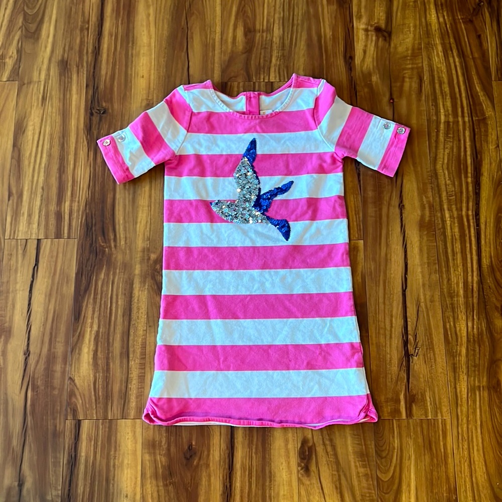Cute pink and white dress with a blue and silver bird